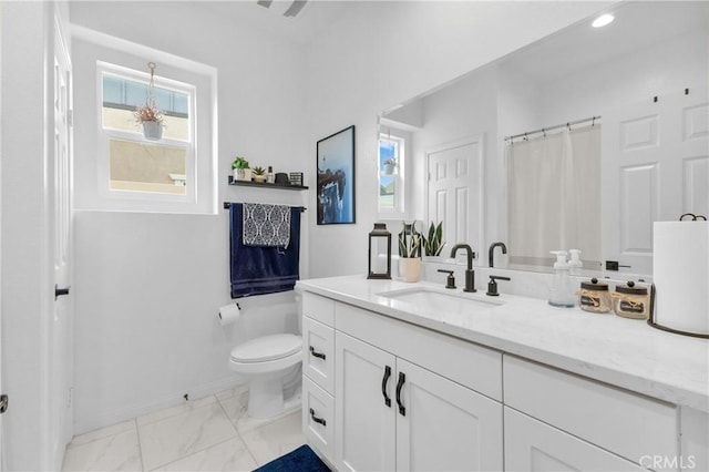 bathroom featuring vanity and toilet