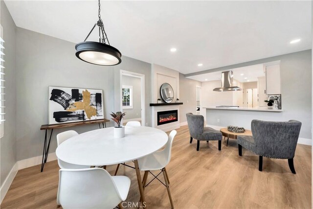 dining room featuring light wood-type flooring