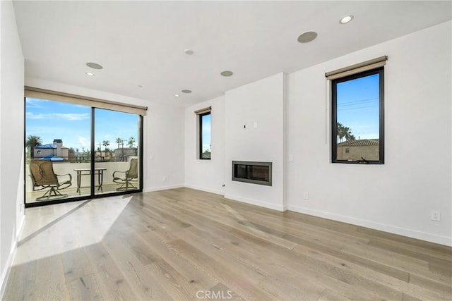 unfurnished living room featuring light hardwood / wood-style floors