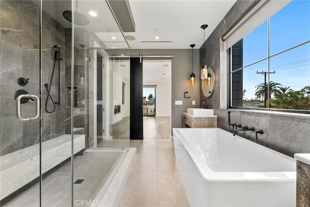 bathroom featuring tile patterned floors, vanity, and separate shower and tub