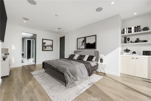 bedroom with light wood-type flooring