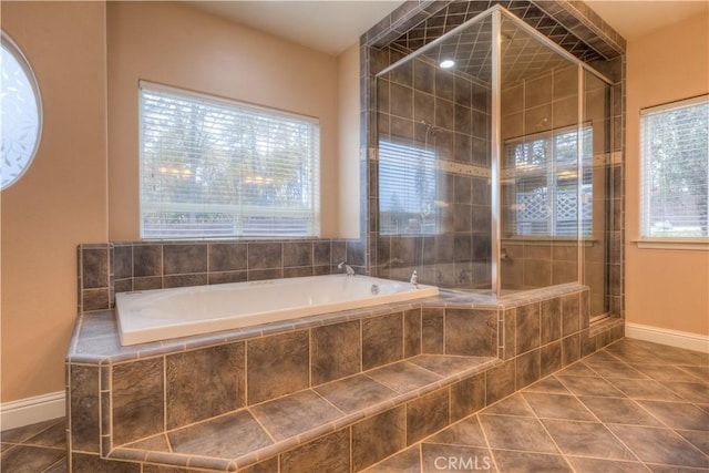 bathroom with shower with separate bathtub and tile patterned floors