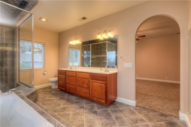 bathroom featuring vanity, tile patterned floors, ceiling fan, and a bathtub