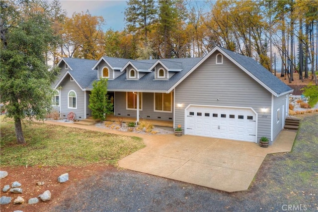 new england style home with a garage and a front yard