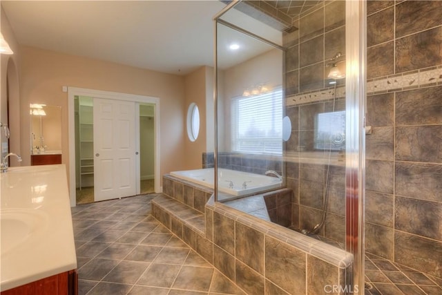 bathroom featuring separate shower and tub, tile patterned floors, and vanity