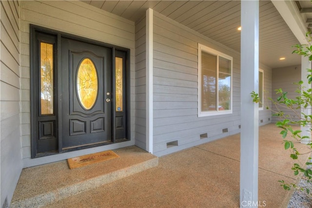 property entrance featuring a porch