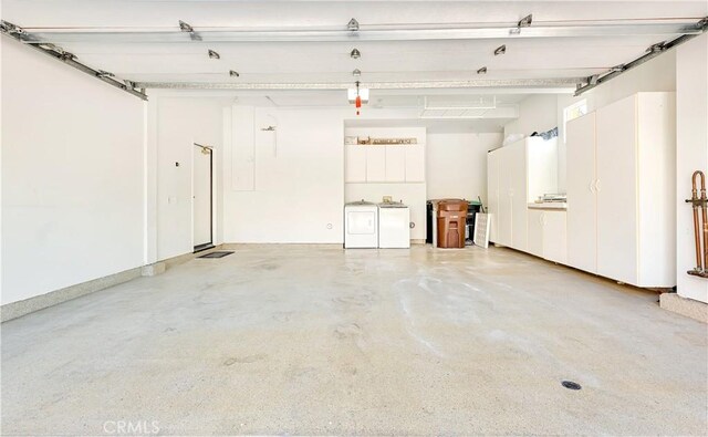 garage featuring washer and clothes dryer