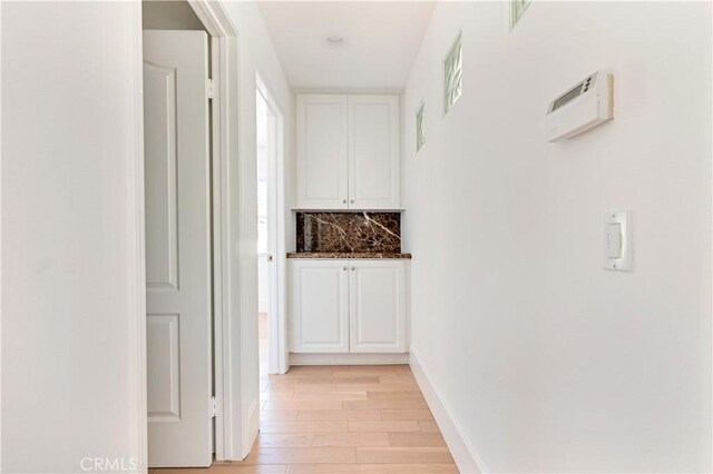 hallway featuring light hardwood / wood-style flooring