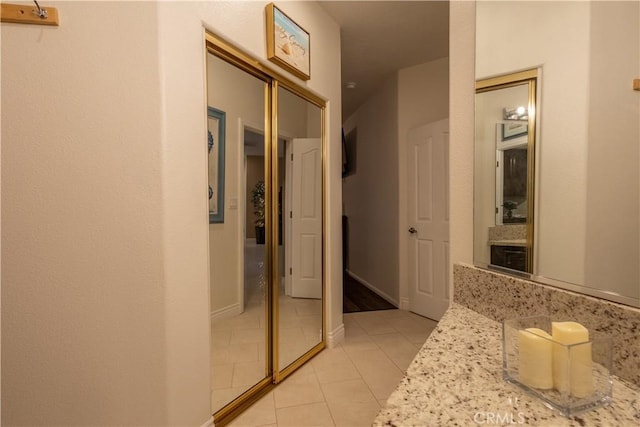 bathroom featuring tile patterned flooring and vanity