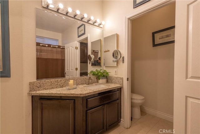 bathroom featuring tile patterned flooring, vanity, curtained shower, and toilet