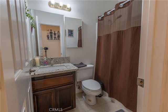 bathroom featuring tile patterned floors, vanity, toilet, and a shower with curtain