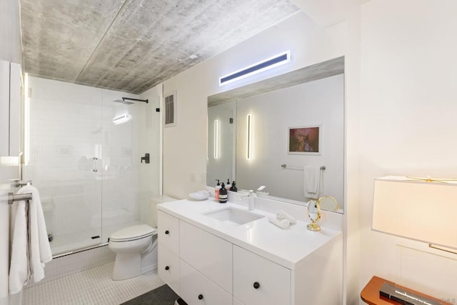 bathroom with toilet, vanity, tile patterned floors, and an enclosed shower