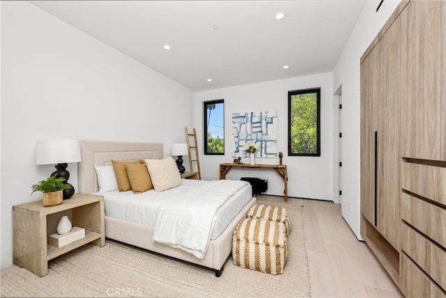 bedroom with light wood-type flooring