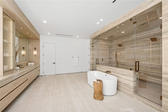 bathroom featuring vanity, independent shower and bath, and hardwood / wood-style flooring