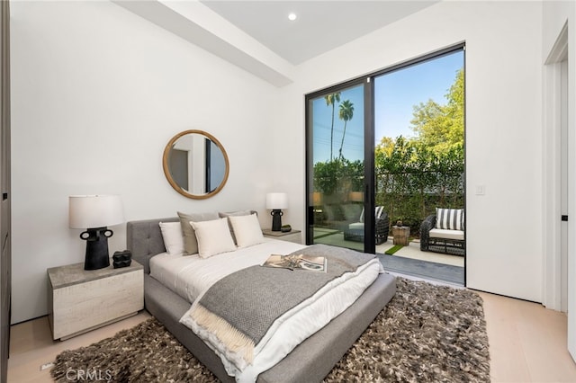 bedroom featuring access to outside and light wood-type flooring