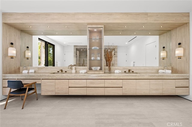 bathroom featuring vanity and concrete floors