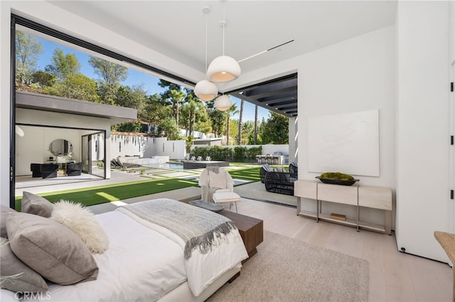 bedroom with light hardwood / wood-style floors