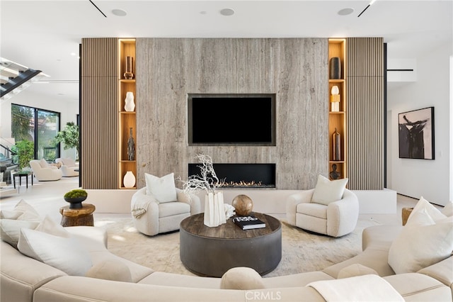 living room featuring a premium fireplace