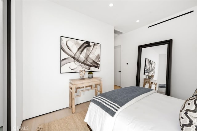 bedroom with light hardwood / wood-style floors