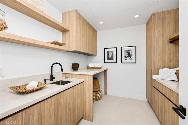 kitchen featuring sink and light colored carpet