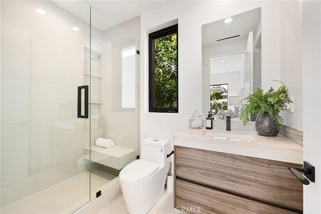 bathroom with tile patterned flooring, vanity, an enclosed shower, and toilet