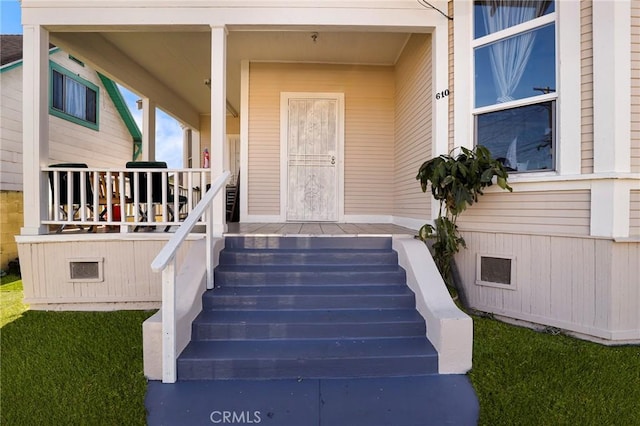 doorway to property with a porch
