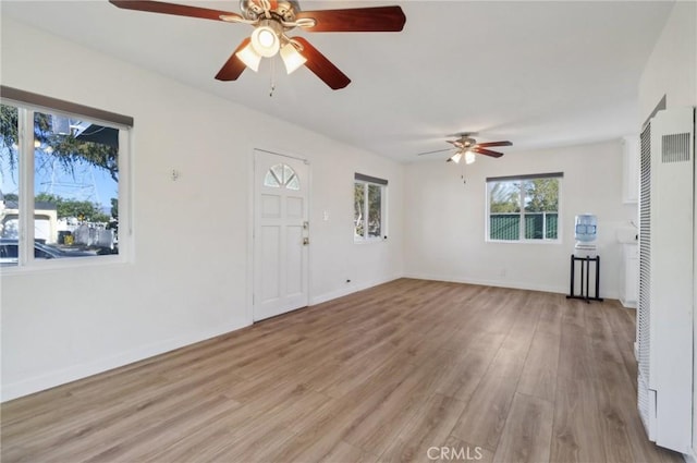 unfurnished living room featuring light wood-type flooring