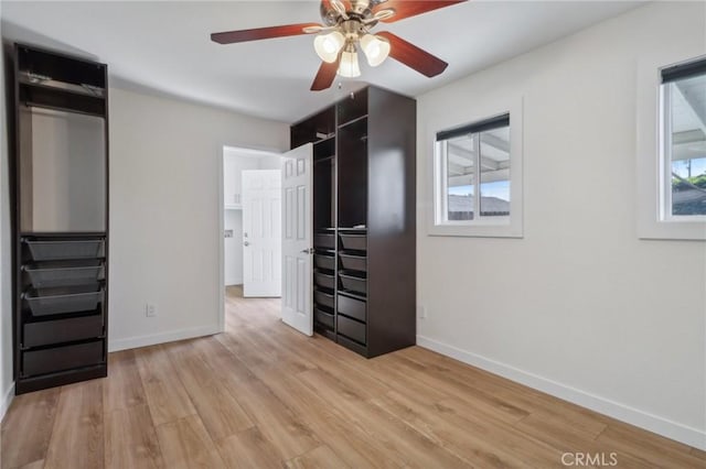 unfurnished bedroom featuring ceiling fan and light hardwood / wood-style flooring