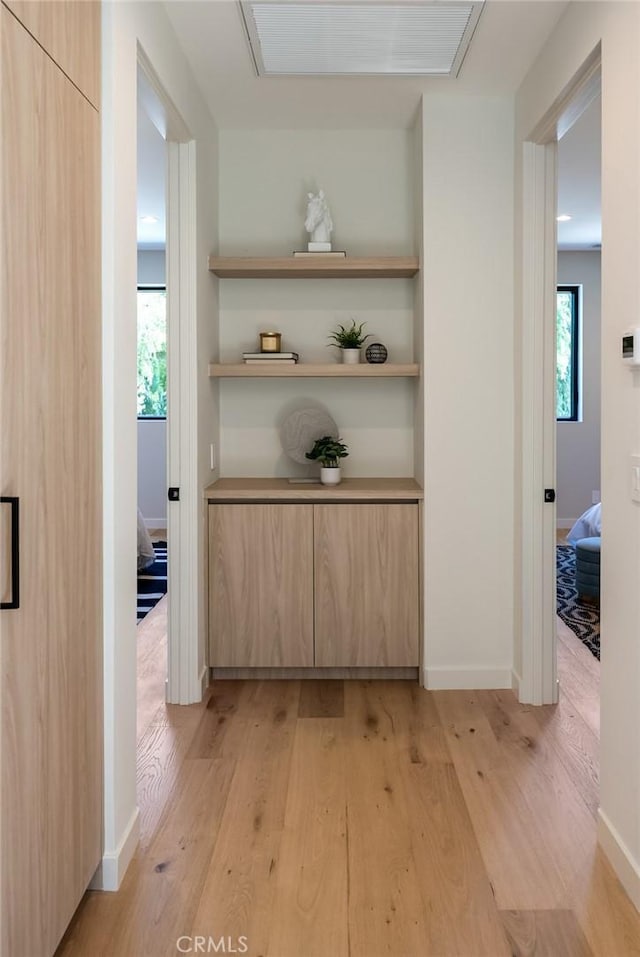 corridor featuring light hardwood / wood-style floors