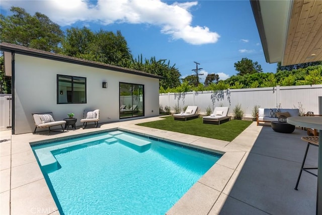 view of pool featuring a patio area