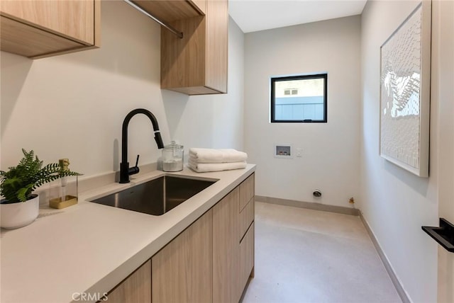 kitchen with sink and light brown cabinets