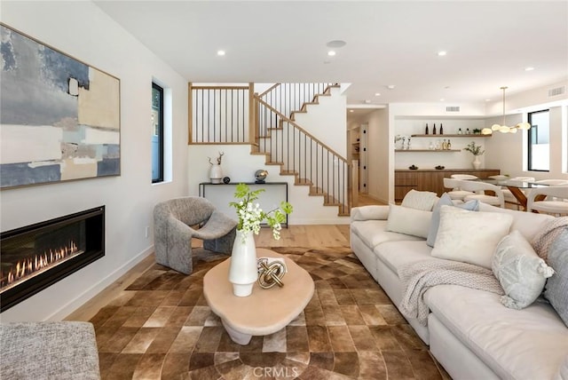 living room featuring dark hardwood / wood-style flooring and plenty of natural light