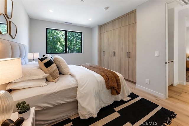 bedroom with light hardwood / wood-style floors