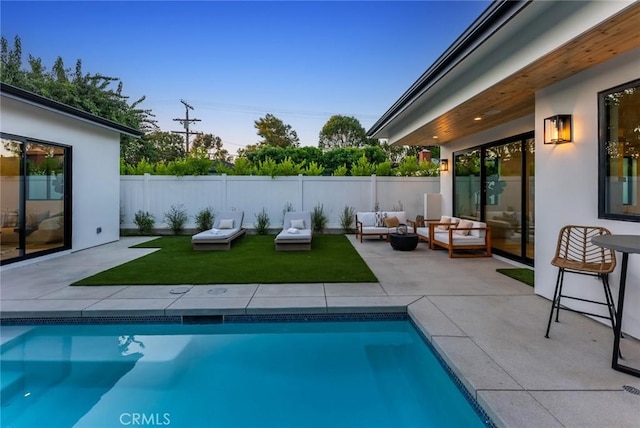 view of pool with outdoor lounge area and a patio area