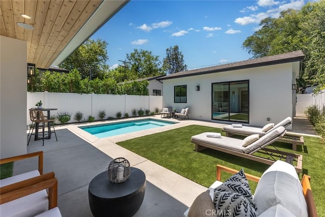 view of swimming pool featuring an outdoor living space, a patio, and a lawn