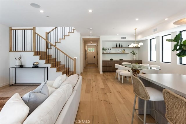 living room with light hardwood / wood-style flooring