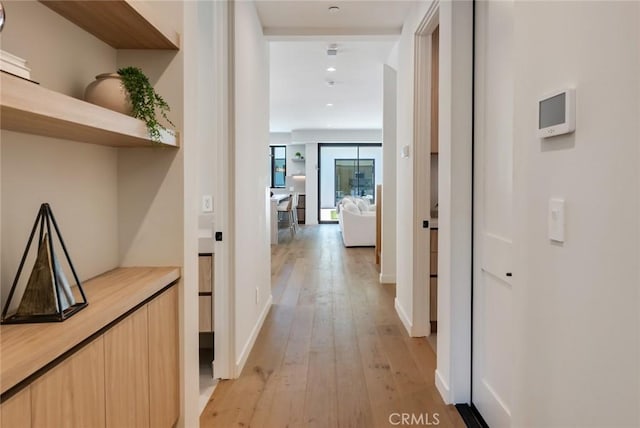 hallway featuring light wood-type flooring