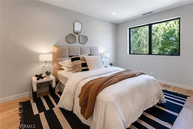 bedroom featuring hardwood / wood-style floors