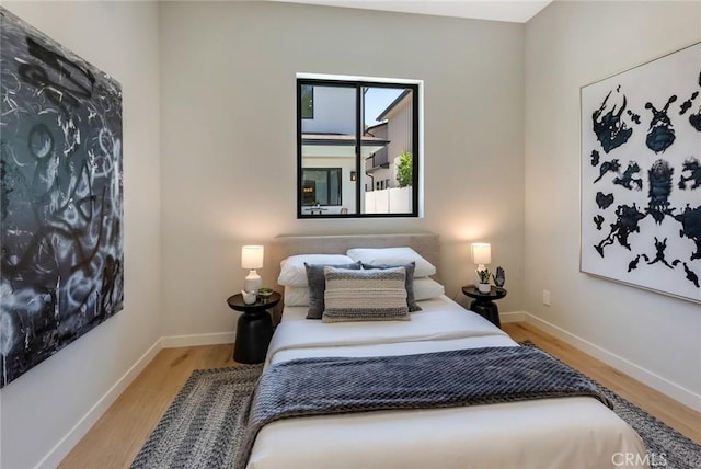 bedroom with light hardwood / wood-style flooring