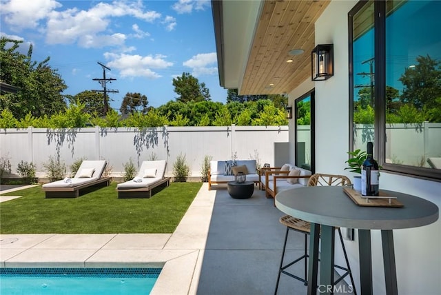 view of patio featuring a fenced in pool