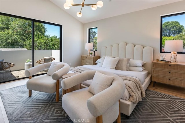 bedroom with vaulted ceiling, multiple windows, and dark hardwood / wood-style floors