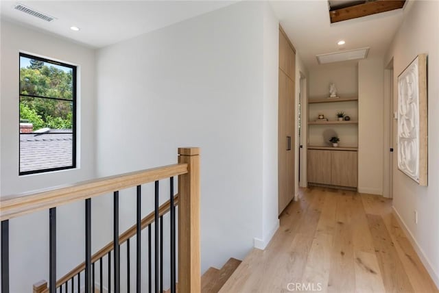 corridor featuring light hardwood / wood-style floors