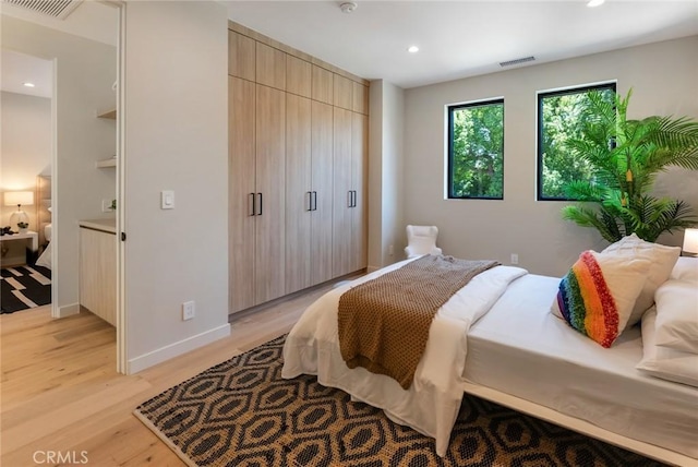 bedroom featuring light hardwood / wood-style floors