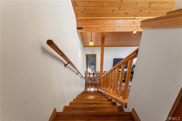 stairway featuring wood ceiling