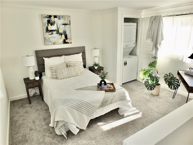 bedroom featuring ornamental molding, stacked washing maching and dryer, and light colored carpet