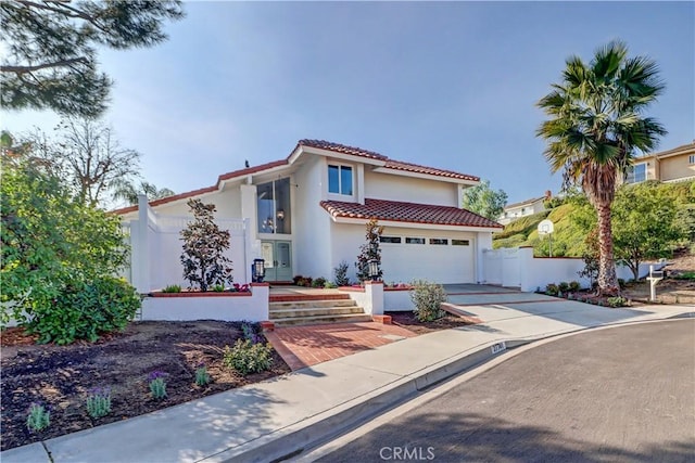 mediterranean / spanish-style home featuring a garage