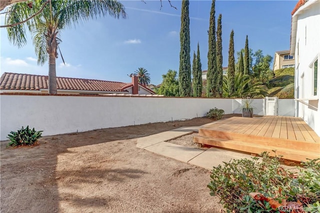 view of yard featuring a wooden deck