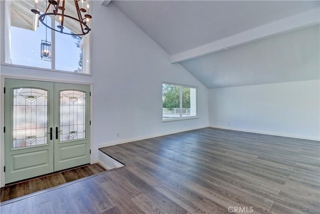 foyer entrance with beam ceiling, wood-type flooring, high vaulted ceiling, french doors, and a chandelier