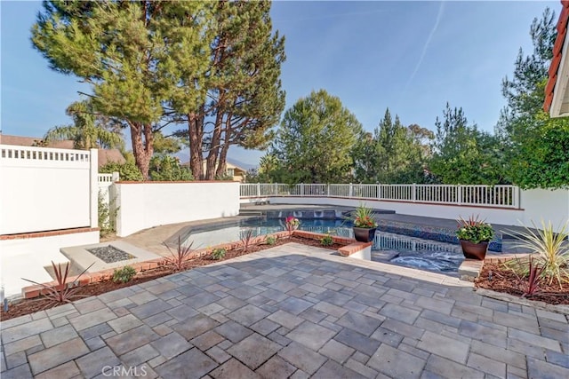 view of patio with a fenced in pool