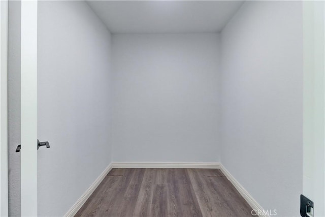 spare room with hardwood / wood-style flooring